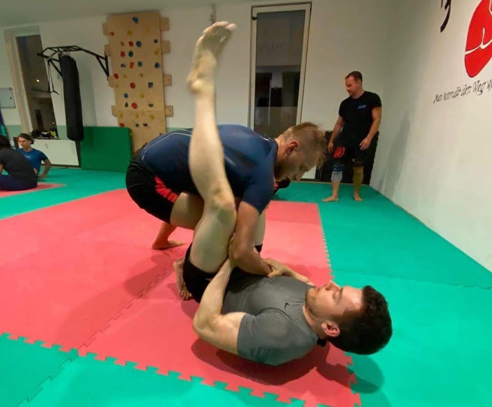 Two men sparring Brazilian Jiu-Jitsu