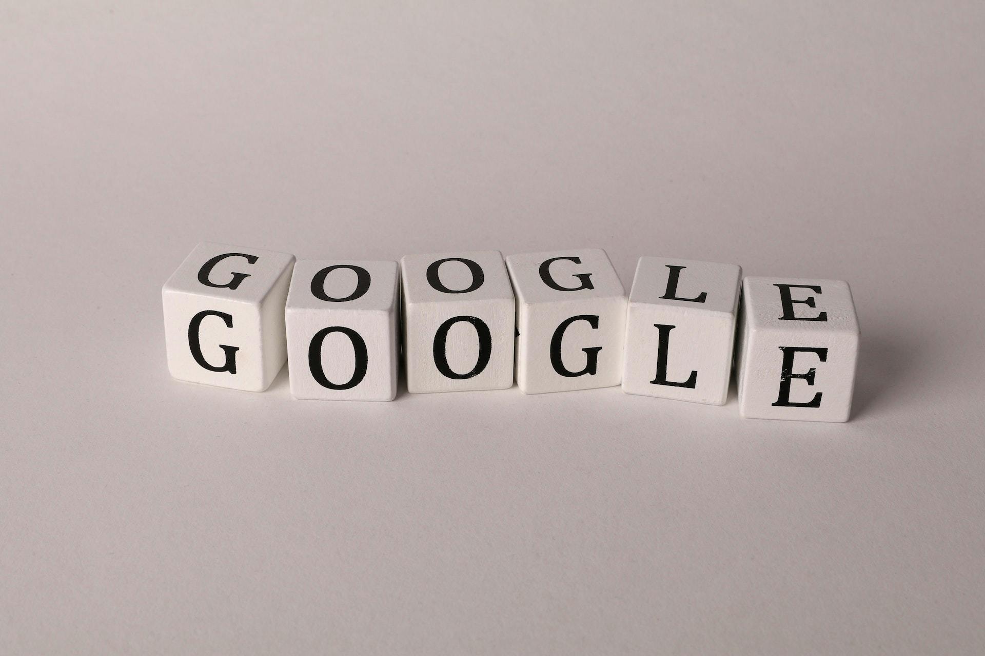 A bunch of cubes with letters displaying the word "google"